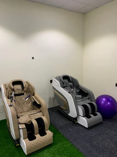 Recovery area with massage chairs and stability balls